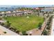 Aerial view of the community park with grassy fields and shaded seating areas, perfect for community gatherings at 21934 E Lords Ct, Queen Creek, AZ 85142