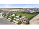 Aerial view of the community park with grassy fields, playground, and shaded seating areas at 21934 E Lords Ct, Queen Creek, AZ 85142