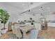 Bright, open dining area leading to a modern kitchen with island seating and stainless steel appliances at 21934 E Lords Ct, Queen Creek, AZ 85142