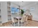 Inviting dining room with natural light, modern lighting fixture, and neutral decor, perfect for Gathering meals at 21934 E Lords Ct, Queen Creek, AZ 85142