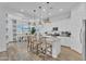 Bright kitchen featuring a center island with barstool seating, modern appliances, and views of the dining area at 21934 E Lords Ct, Queen Creek, AZ 85142