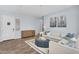 Open living space with stylish furniture, wood floors, and ample natural light at 21934 E Lords Ct, Queen Creek, AZ 85142