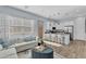 Cozy living space with kitchen island, stainless steel appliances, and comfortable seating at 21934 E Lords Ct, Queen Creek, AZ 85142