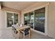 Relaxing covered patio featuring an outdoor dining set, seamlessly blending indoor-outdoor living at 21934 E Lords Ct, Queen Creek, AZ 85142