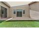Private backyard with artificial turf, brick pavers, and a covered patio at 21973 N 102Nd Ln # 411, Peoria, AZ 85383