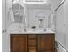 Well-lit bathroom featuring a double vanity and shower/tub combo at 21973 N 102Nd Ln # 411, Peoria, AZ 85383