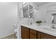 Bathroom with dual sinks, lots of counter space, and a large mirror at 21973 N 102Nd Ln # 411, Peoria, AZ 85383