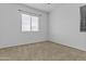 Neutral bedroom featuring a window, and plush carpet at 21973 N 102Nd Ln # 411, Peoria, AZ 85383