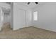 Neutral bedroom featuring a ceiling fan, window, and closet with sliding doors at 21973 N 102Nd Ln # 411, Peoria, AZ 85383