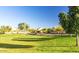 Community park featuring lush green grass and mature trees at 21973 N 102Nd Ln # 411, Peoria, AZ 85383