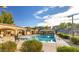 Community pool with covered lounge areas perfect for relaxing and socializing at 21973 N 102Nd Ln # 411, Peoria, AZ 85383