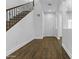 Bright foyer with beautiful wood-look flooring and a staircase with decorative iron spindles at 21973 N 102Nd Ln # 411, Peoria, AZ 85383