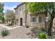 Charming two-story home featuring a front yard with low-maintenance desert landscaping at 21973 N 102Nd Ln # 411, Peoria, AZ 85383