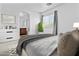 Sun-filled bedroom with an ensuite bathroom providing a private retreat at 21973 N 102Nd Ln # 411, Peoria, AZ 85383