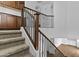 Elegant staircase with decorative metal railings and carpeted steps adding architectural interest at 21973 N 102Nd Ln # 411, Peoria, AZ 85383