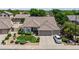 A beautiful, modern home with manicured landscaping, a two-car garage, and a lovely tiled roof at 2243 E Cortez Dr, Gilbert, AZ 85234