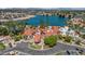Breathtaking aerial view of the clubhouse, scenic lake, and lush green landscape at 2243 E Cortez Dr, Gilbert, AZ 85234