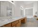 Bathroom featuring dual sinks with vanity and bathtub at 2243 E Cortez Dr, Gilbert, AZ 85234