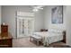 Bright bedroom with white plantation shutters, neutral walls, and comfortable furnishings at 2243 E Cortez Dr, Gilbert, AZ 85234