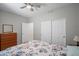 Carpeted bedroom with ceiling fan, dresser, and window at 2243 E Cortez Dr, Gilbert, AZ 85234