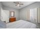 Carpeted bedroom featuring ceiling fan, dresser and window for natural light at 2243 E Cortez Dr, Gilbert, AZ 85234