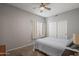 Carpeted bedroom with ceiling fan and sliding door closet at 2243 E Cortez Dr, Gilbert, AZ 85234