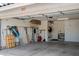 Well-organized garage interior featuring ample storage space, shelving units, and an automatic door opener for convenience at 2243 E Cortez Dr, Gilbert, AZ 85234