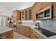 Well-appointed kitchen showcasing custom cabinets, elegant countertops, and stainless steel appliances at 2243 E Cortez Dr, Gilbert, AZ 85234