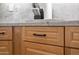 Close-up of light wood kitchen cabinets with modern black pulls and elegant countertop at 2243 E Cortez Dr, Gilbert, AZ 85234