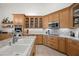 Close-up of the kitchen featuring custom cabinets, stainless steel appliances, and elegant countertops at 2243 E Cortez Dr, Gilbert, AZ 85234