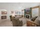 Bright living room with tile floors, neutral walls, fireplace, and comfortable seating at 2243 E Cortez Dr, Gilbert, AZ 85234