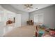 Open office space leads into a playroom featuring neutral walls, beige carpet, and playful decor at 2243 E Cortez Dr, Gilbert, AZ 85234