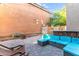 Cozy backyard patio with comfortable seating, pavers, and string lighting at 2275 N Heritage St, Buckeye, AZ 85396