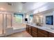 Bright bathroom features dual sinks, walk-in shower, and separate tub at 2275 N Heritage St, Buckeye, AZ 85396