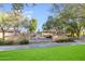 Beautiful community fountain surrounded by lush landscaping and mature trees at 2275 N Heritage St, Buckeye, AZ 85396