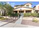 Charming two-story home with a welcoming front porch and beautifully landscaped front yard at 2275 N Heritage St, Buckeye, AZ 85396