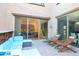 Relaxing patio with comfortable seating area, pavers, and access from kitchen and dining at 2275 N Heritage St, Buckeye, AZ 85396