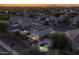 Aerial view of a residential neighborhood featuring a home with a backyard pool, patio, outdoor seating, and a separate shed at 2661 E Los Alamos Ct, Gilbert, AZ 85295