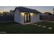 Charming backyard featuring a well-maintained shed with dark trim and glass doors, set on a lush lawn with stepping stones at 2661 E Los Alamos Ct, Gilbert, AZ 85295