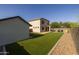 Expansive backyard with artificial grass, a shed, and well-maintained landscaping, perfect for outdoor living at 2661 E Los Alamos Ct, Gilbert, AZ 85295