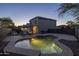 Spacious backyard featuring a kidney-shaped pool, lounge chairs, a covered patio, and lush landscaping for relaxation and entertainment at 2661 E Los Alamos Ct, Gilbert, AZ 85295