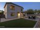 Beautiful backyard featuring green grass, patio, a built-in grill and seating area at 2661 E Los Alamos Ct, Gilbert, AZ 85295