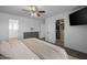 Cozy bedroom with a ceiling fan, dresser, and closet with ample storage space at 2661 E Los Alamos Ct, Gilbert, AZ 85295
