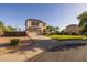 Two-story home featuring a well-manicured lawn, desert landscaping, and an attached two-car garage at 2661 E Los Alamos Ct, Gilbert, AZ 85295