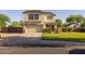 Beautiful two-story home with a spacious lawn, attached garage, stone accents, and a cozy entrance with a wreath, great curb appeal at 2661 E Los Alamos Ct, Gilbert, AZ 85295