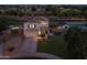Inviting two-story home featuring a well-manicured lawn, attached garage, and private backyard pool, perfect for outdoor entertainment at 2661 E Los Alamos Ct, Gilbert, AZ 85295