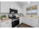 Modern kitchen featuring white cabinets, stainless steel appliances, and sleek countertops at 2661 E Los Alamos Ct, Gilbert, AZ 85295