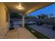 Covered patio provides outdoor relaxation with a pool, fire pit, and seating area at 2661 E Los Alamos Ct, Gilbert, AZ 85295