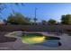Backyard pool view with lounge chairs and a serene ambiance at 2661 E Los Alamos Ct, Gilbert, AZ 85295