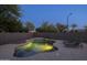 Inviting backyard pool with waterfall feature and lounge chairs for relaxing at 2661 E Los Alamos Ct, Gilbert, AZ 85295